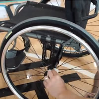 using a cloth to clean wheelchair